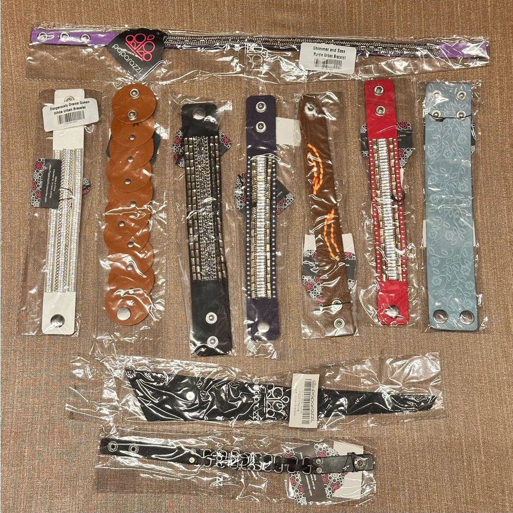 5 sets of wrap bracelets. 
Each set of 10 is $15
All are new. 
One set of mens